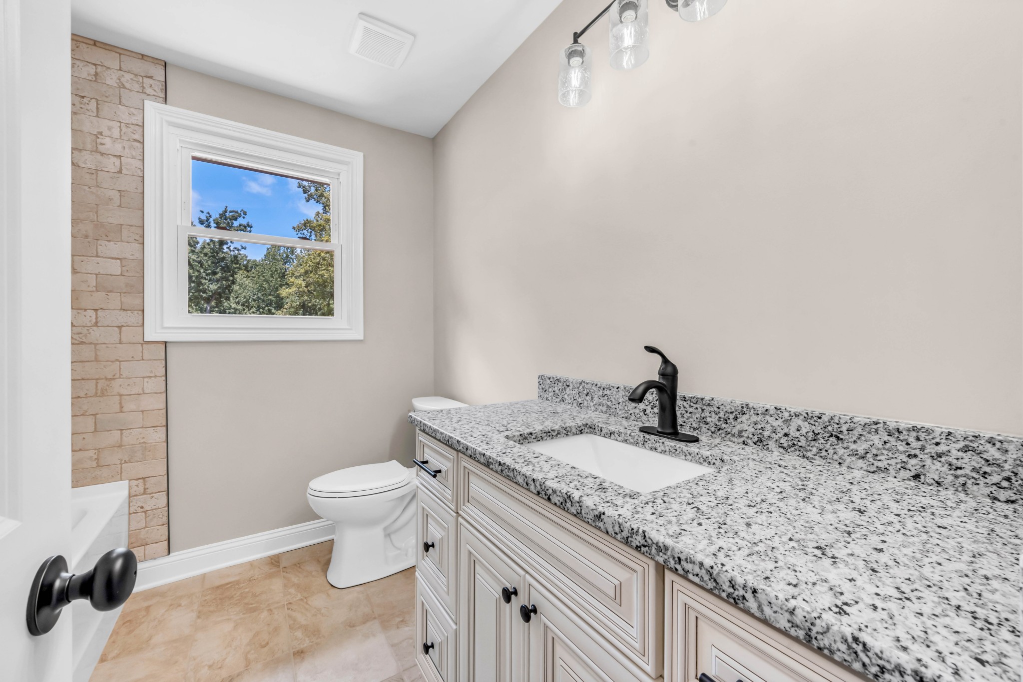 887 Harvey Road Cumberland Furnace, TN 37051 - Photo 16 of 72 a bathroom with a granite countertop sink mirror vanity and toilet