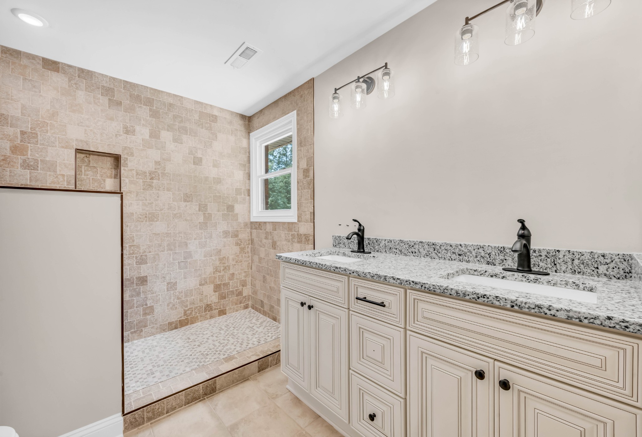 887 Harvey Road Cumberland Furnace, TN 37051 - Photo 24 of 72 a bathroom with a granite countertop sink a mirror and shower