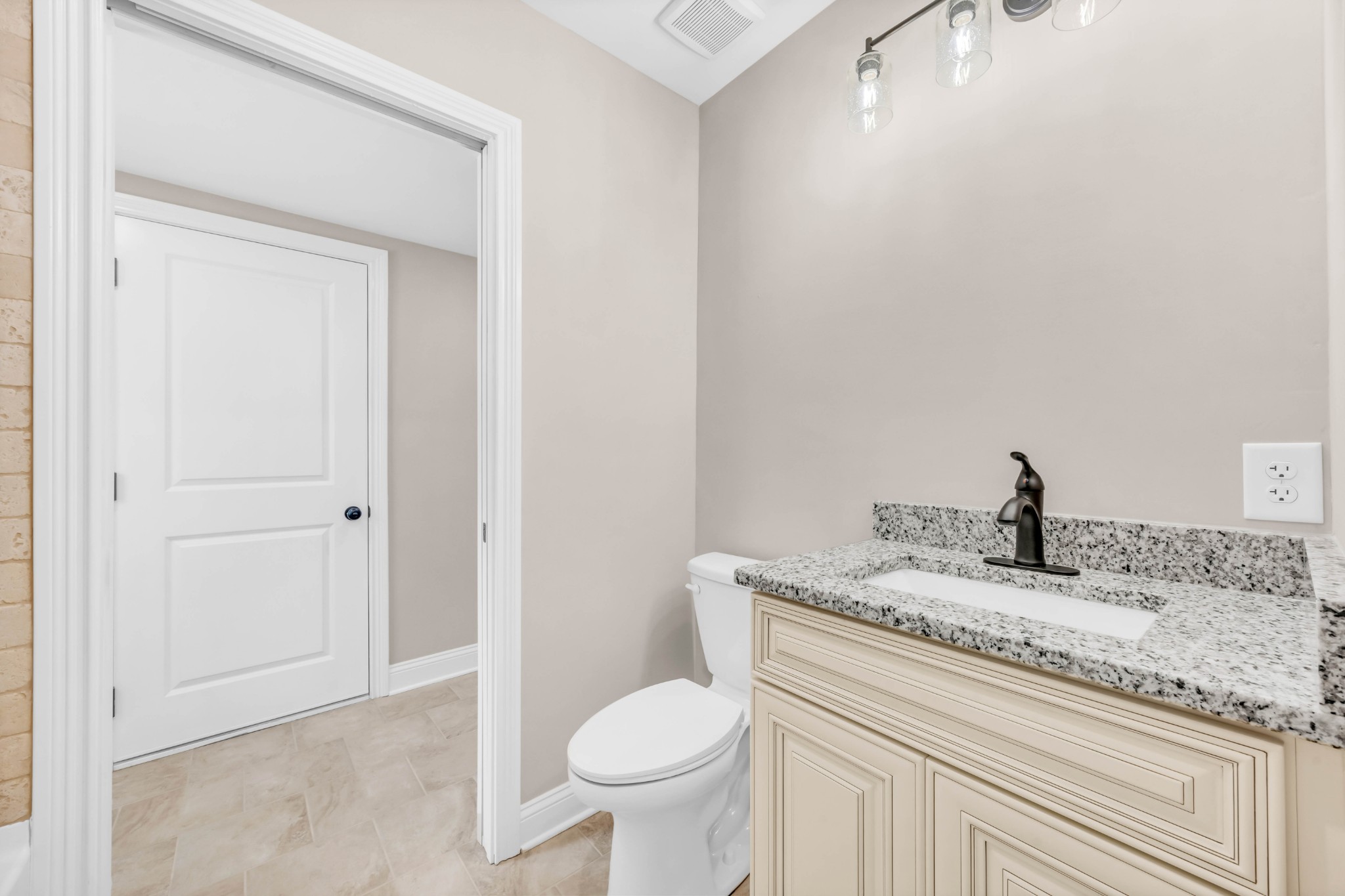 887 Harvey Road Cumberland Furnace, TN 37051 - Photo 33 of 72 a bathroom with a granite countertop sink a toilet and a mirror