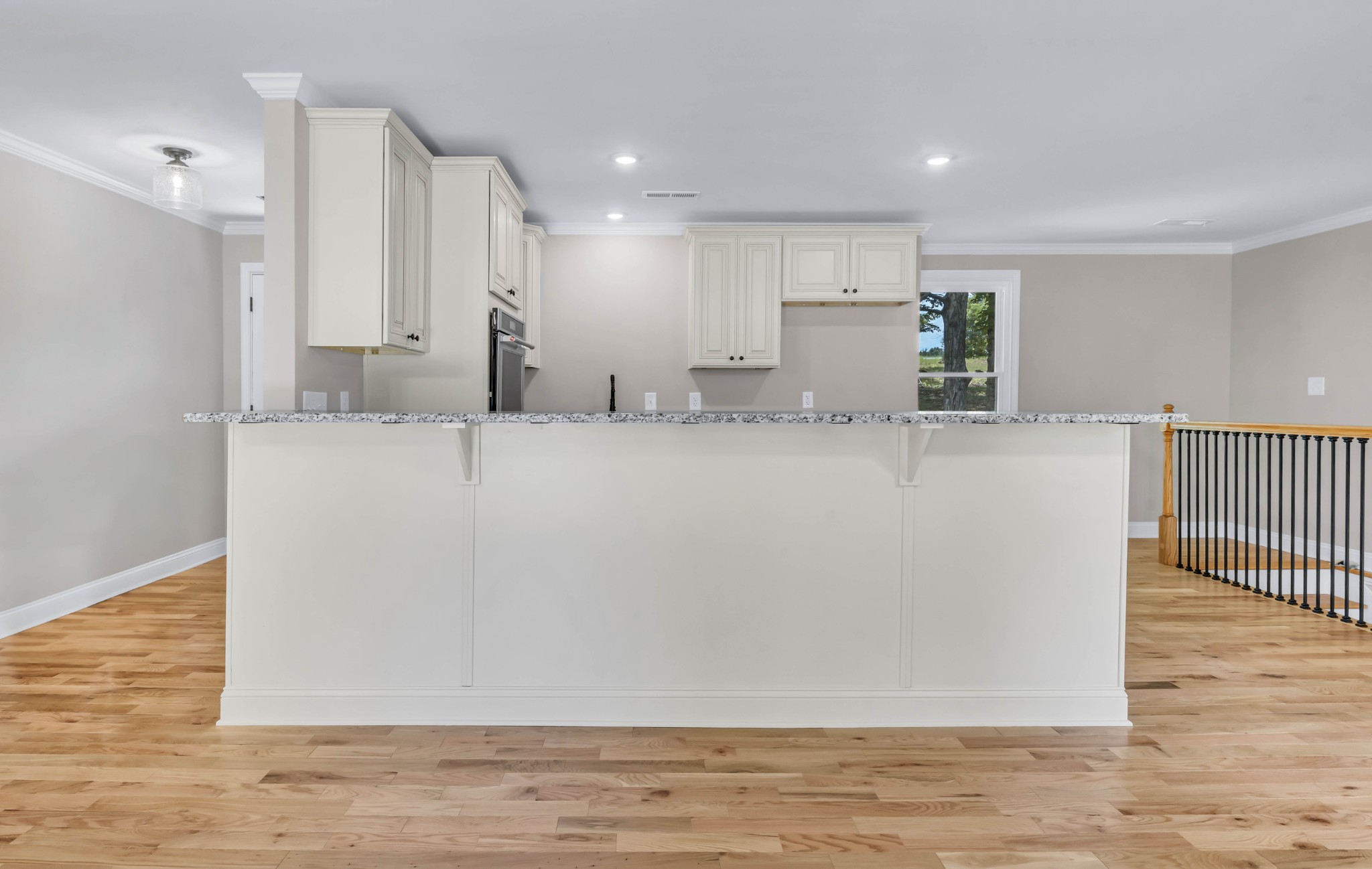 887 Harvey Road Cumberland Furnace, TN 37051 - Photo 35 of 72 a view of a kitchen with kitchen island wooden floor and living room