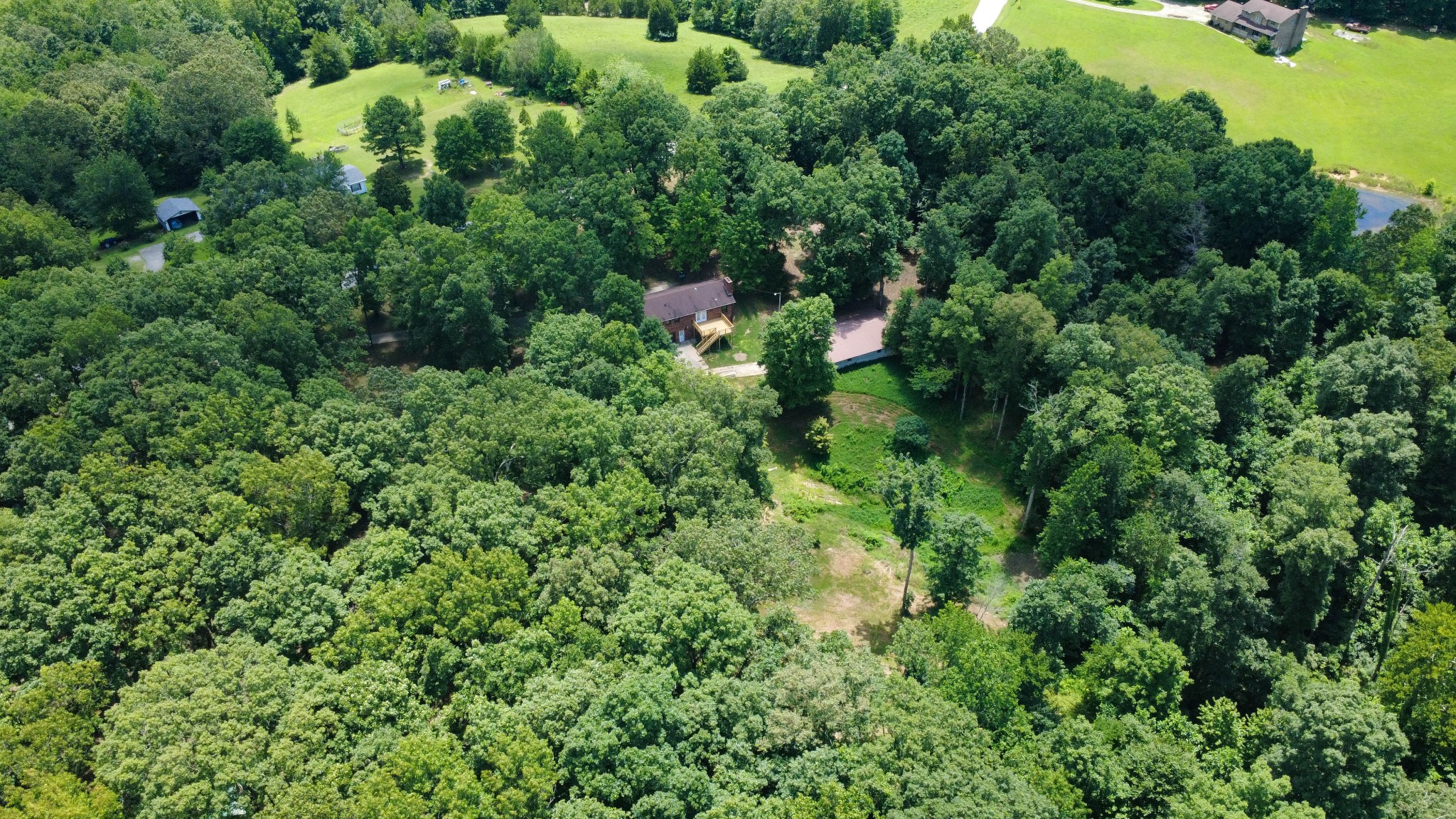 887 Harvey Road Cumberland Furnace, TN 37051 - Photo 60 of 72 an aerial view of a house with yard