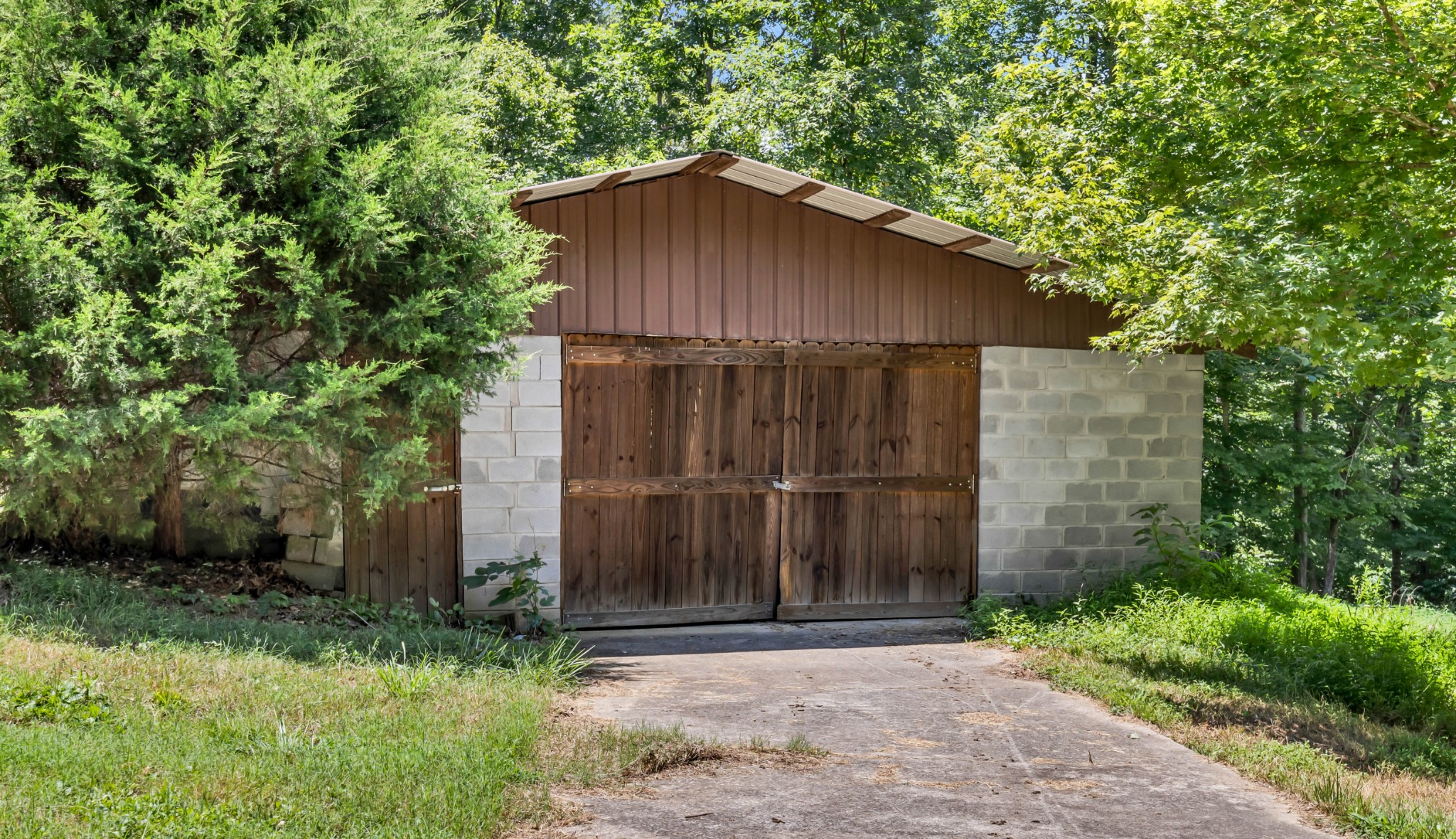 887 Harvey Road Cumberland Furnace, TN 37051 - Photo 65 of 72 a wooden house with trees in the background