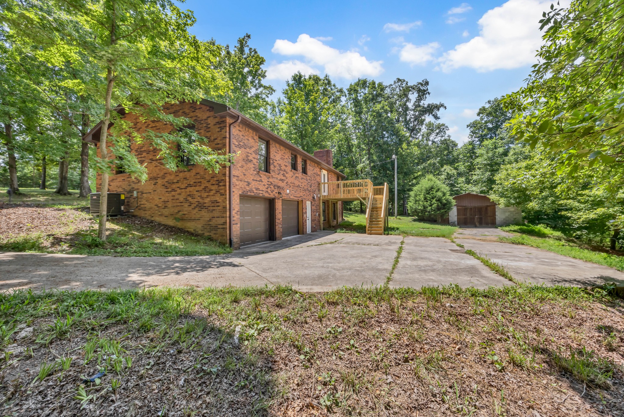 887 Harvey Road Cumberland Furnace, TN 37051 - Photo 67 of 72 a house with trees in front of it