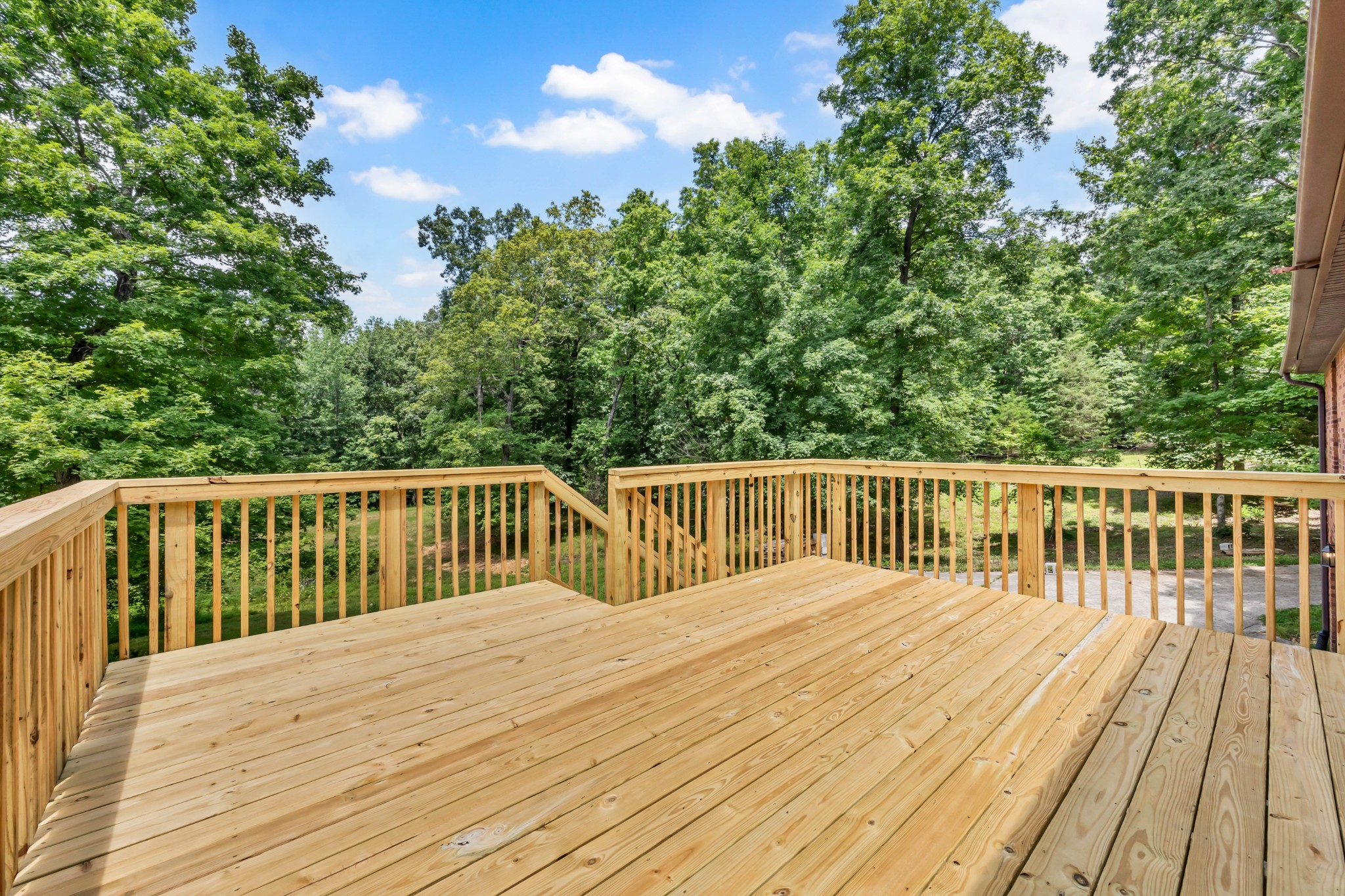 887 Harvey Road Cumberland Furnace, TN 37051 - Photo 71 of 72 a balcony with wooden floor and trees in the background