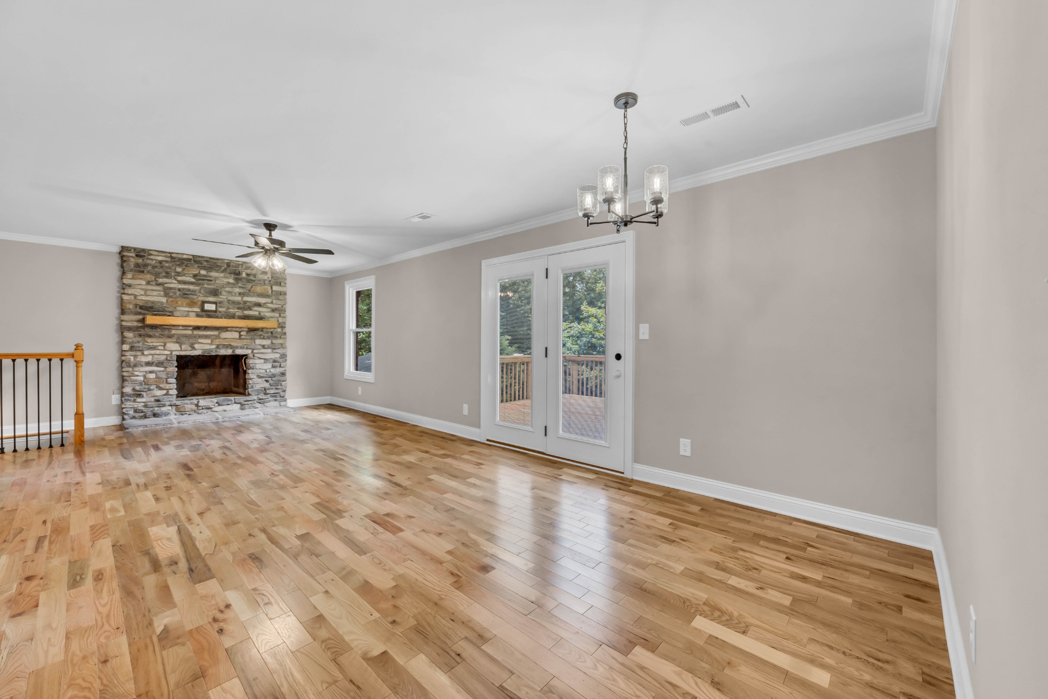 887 Harvey Road Cumberland Furnace, TN 37051 - Photo 8 of 72 a view of empty room with wooden floor and fireplace