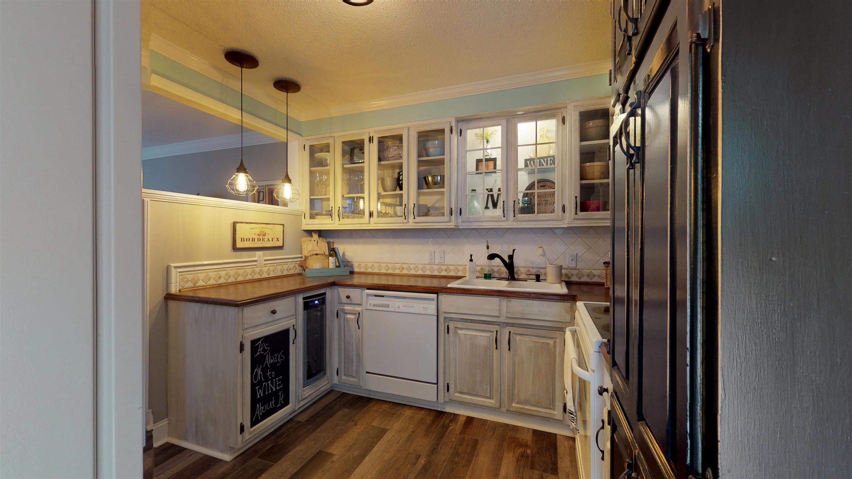 2120 Ovoca Road Tullahoma, TN 37388 - Photo 8 of 28 Glass doors on cabinets and nice pantry