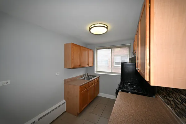 a view of a livingroom with washer and dryer