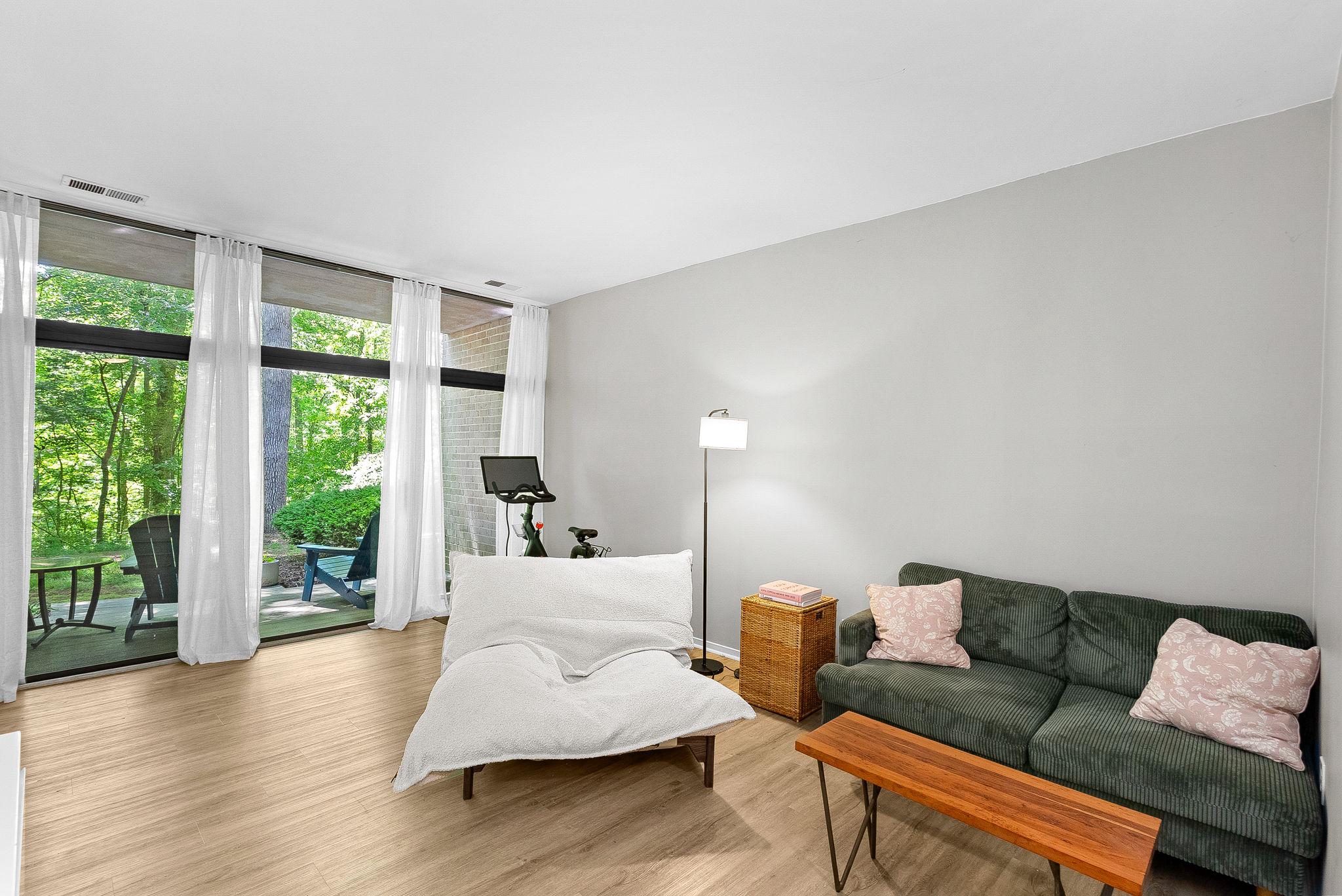 1668 Parkcrest Circle, Unit 100 Reston, VA 20190 - Photo 12 of 34 a living room with furniture and a large window