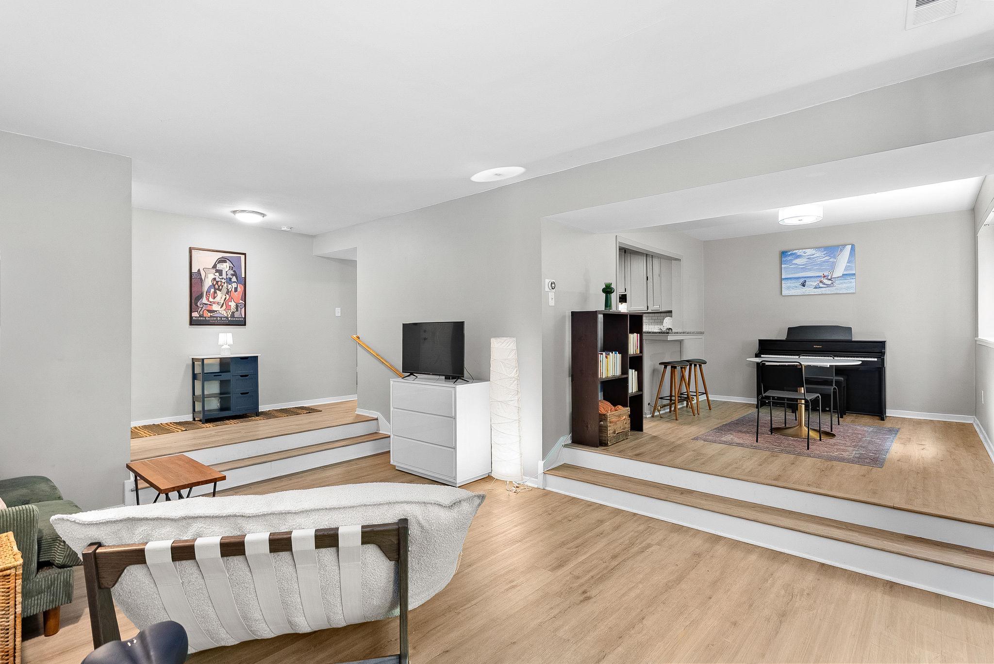 1668 Parkcrest Circle, Unit 100 Reston, VA 20190 - Photo 15 of 34 a bed room with a bed furniture and a flat screen tv