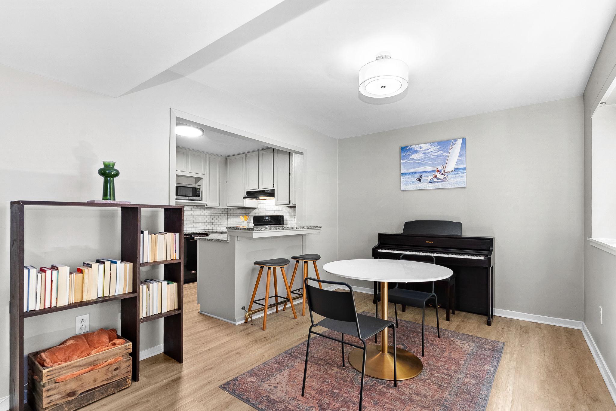 1668 Parkcrest Circle, Unit 100 Reston, VA 20190 - Photo 17 of 34 a view of a dining room with furniture