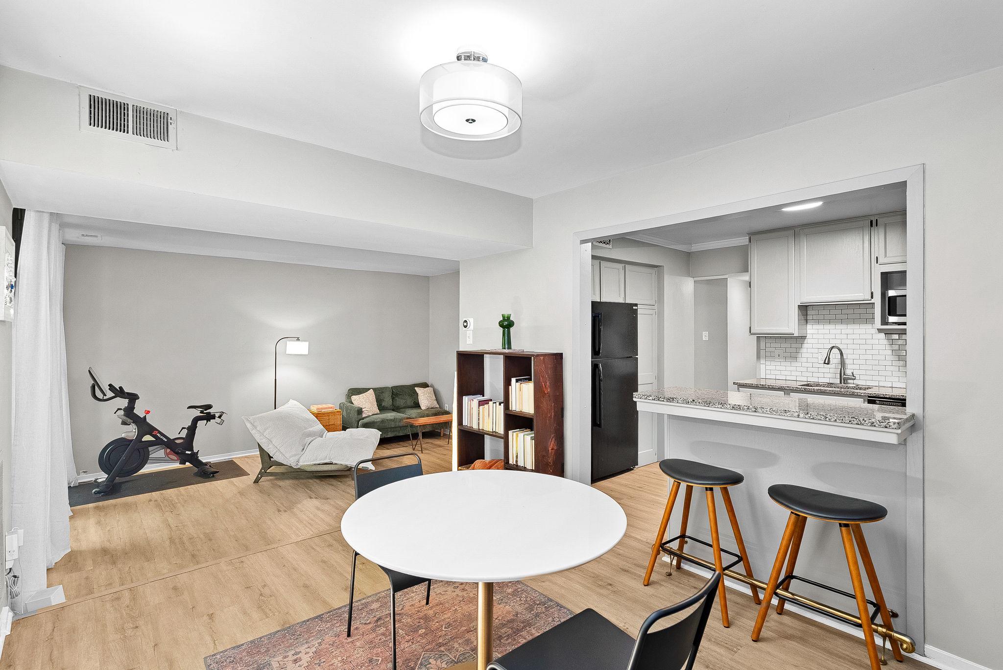 1668 Parkcrest Circle, Unit 100 Reston, VA 20190 - Photo 18 of 34 a living room with furniture a dining table and chairs