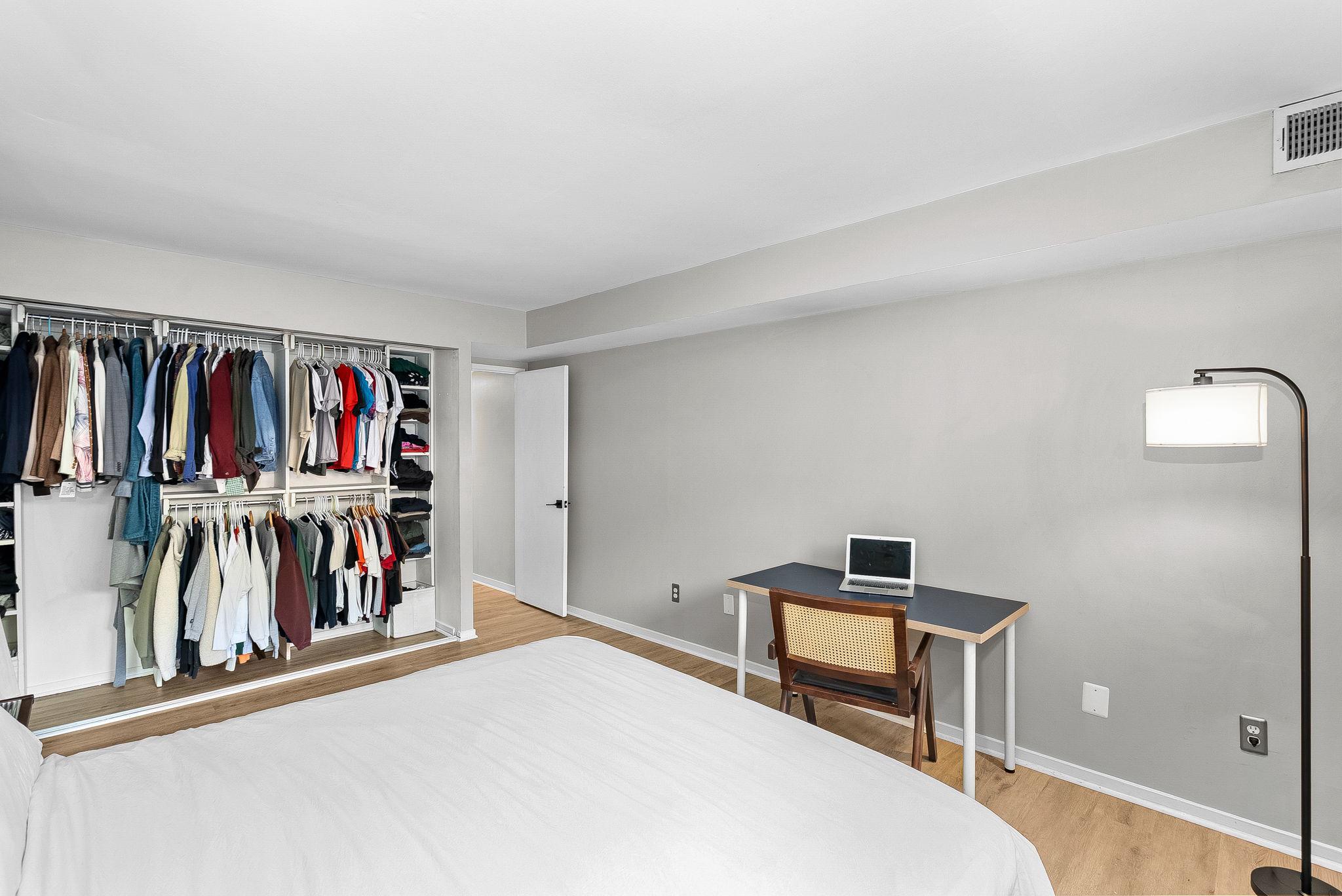 1668 Parkcrest Circle, Unit 100 Reston, VA 20190 - Photo 26 of 34 a bedroom with a bed and a view of closet