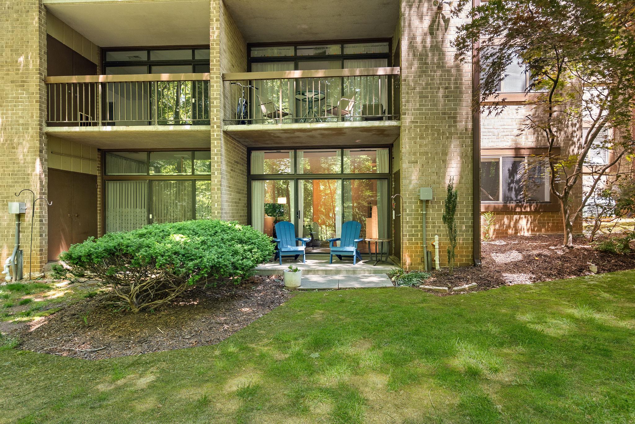 1668 Parkcrest Circle, Unit 100 Reston, VA 20190 - Photo 32 of 34 front view of house with a yard