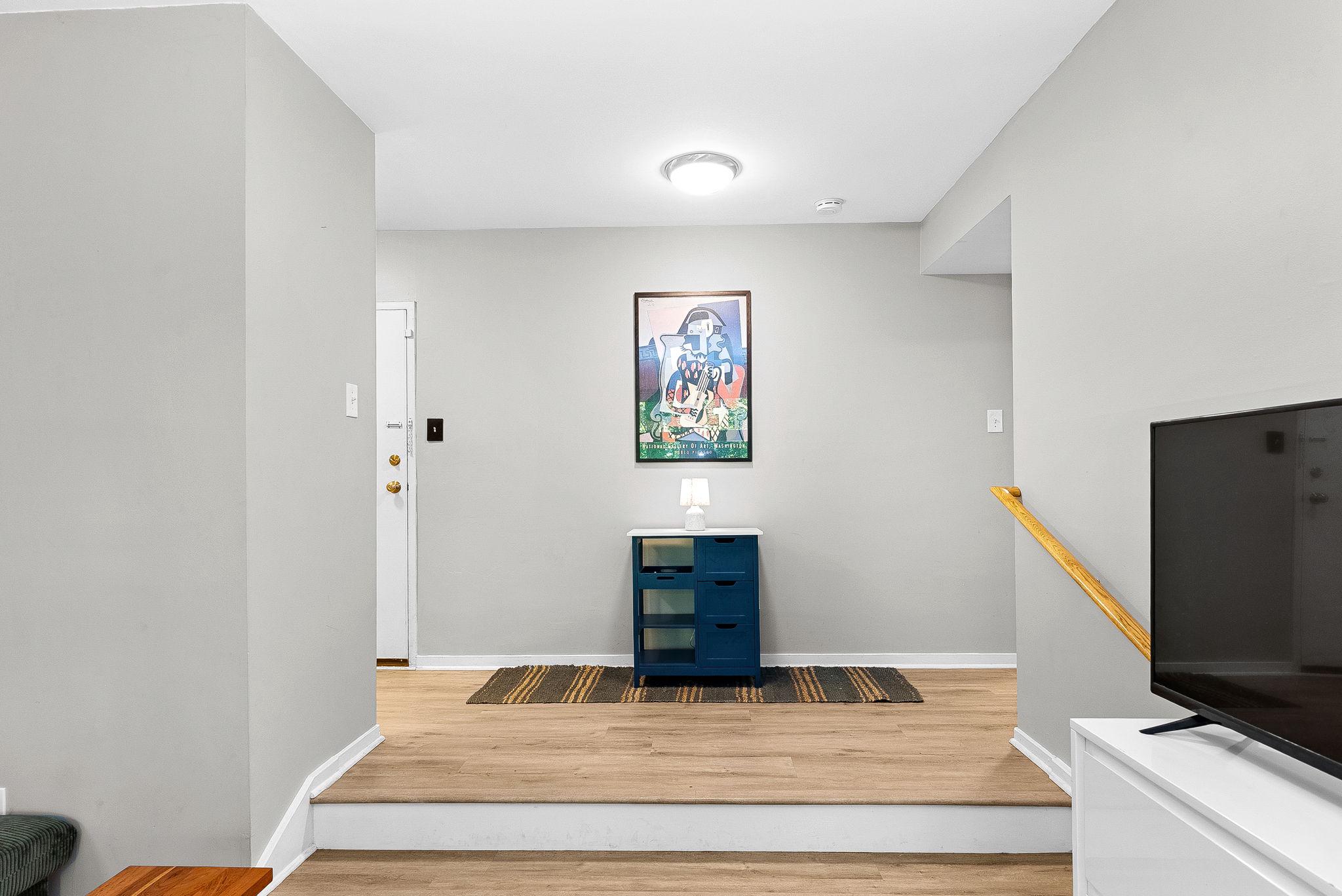 1668 Parkcrest Circle, Unit 100 Reston, VA 20190 - Photo 10 of 34 a bedroom with a bed and a flat screen tv