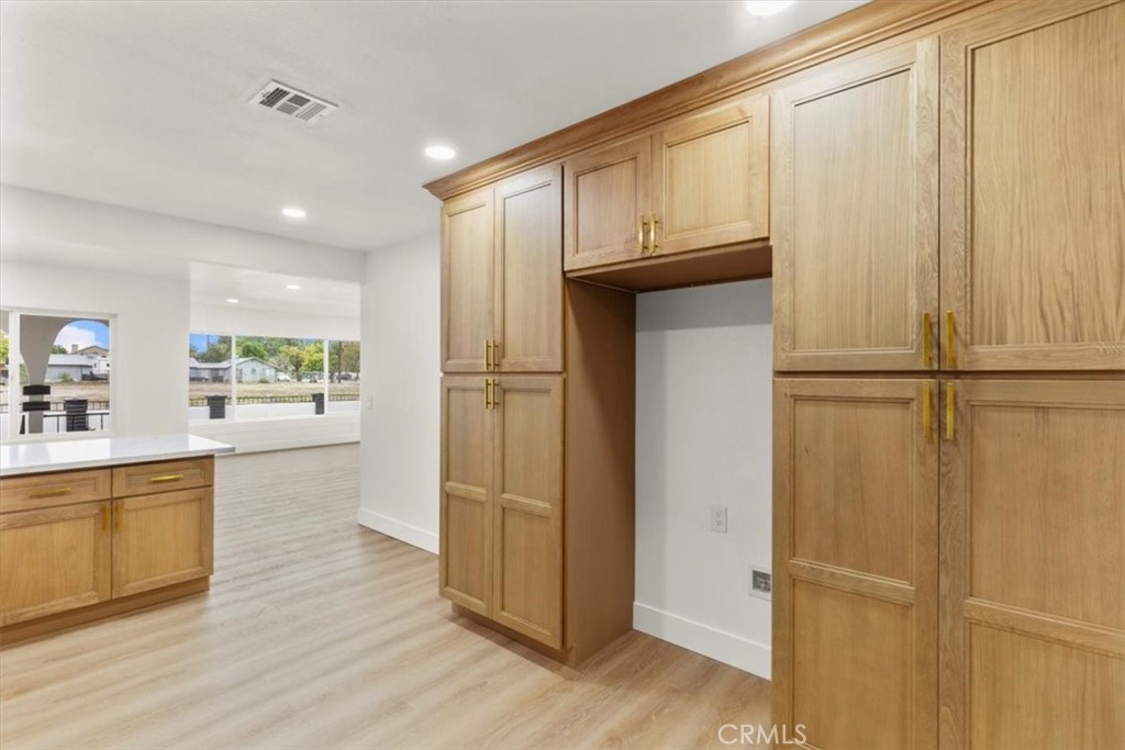 128 North Alessandro Street Hemet, CA 92543 - Photo 13 of 33 a view of kitchen with wooden floor electronic appliances and furniture