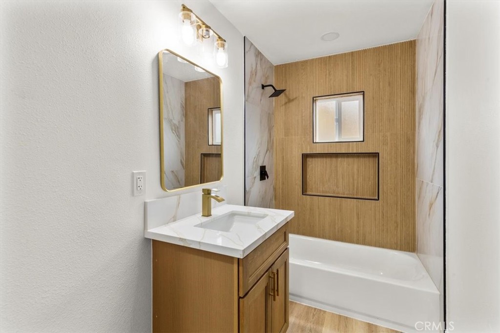 128 North Alessandro Street Hemet, CA 92543 - Photo 17 of 33 a bathroom with a sink and a mirror