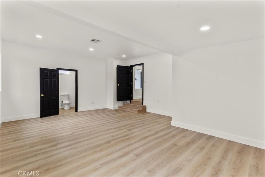 128 North Alessandro Street Hemet, CA 92543 - Photo 23 of 33 a view of an empty room with wooden floor and closet