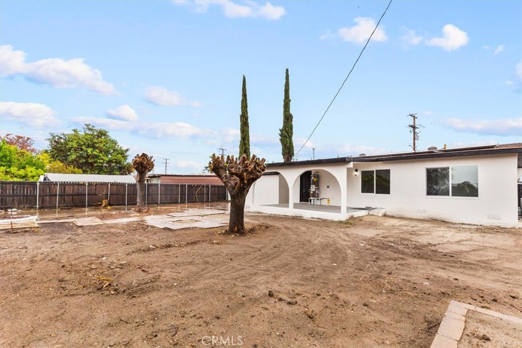 128 North Alessandro Street Hemet, CA 92543 - Photo 30 of 33 a view of a yard with a house