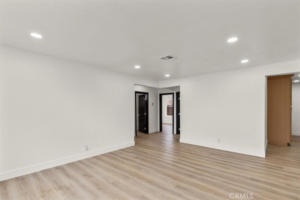 128 North Alessandro Street Hemet, CA 92543 - Photo 4 of 33 a view of an empty room with wooden floor