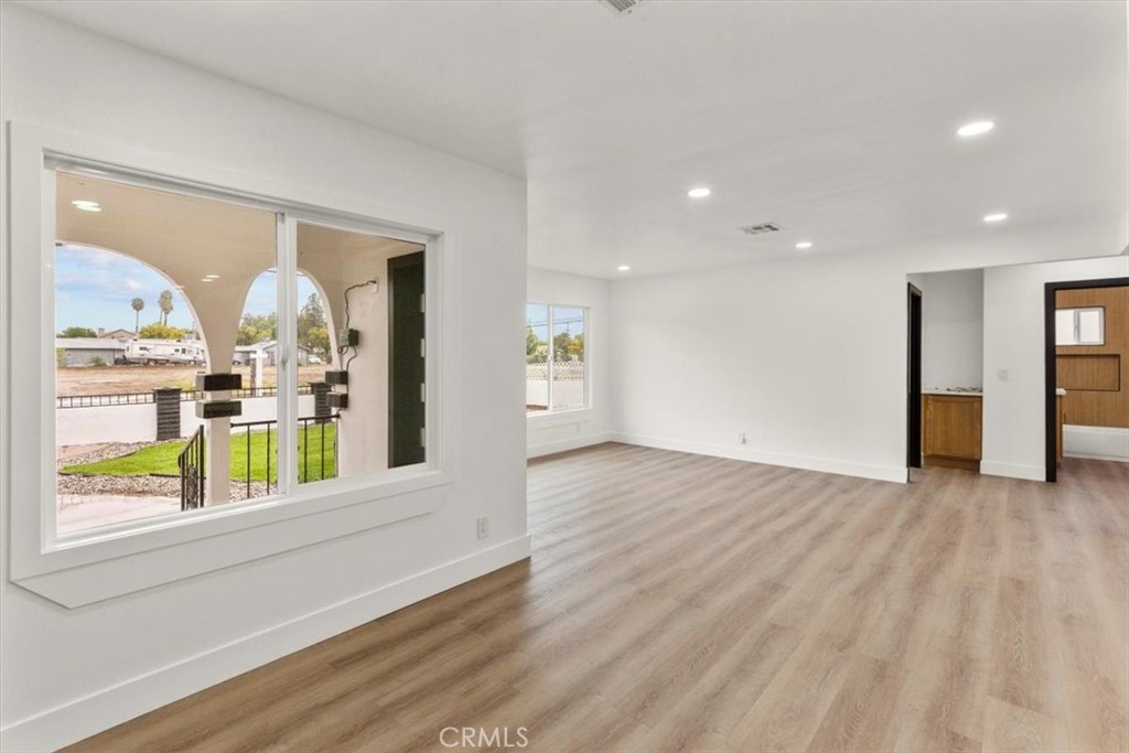 128 North Alessandro Street Hemet, CA 92543 - Photo 7 of 33 a view of an entryway with wooden floor and door