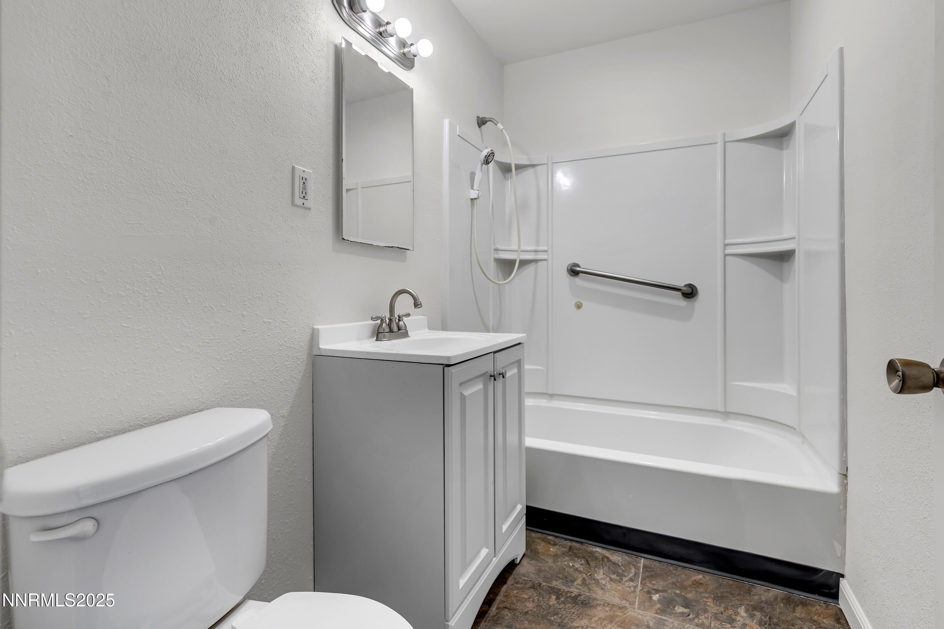 12360 Rocky Mountain Street Reno, NV 89506 - Photo 16 of 29 a bathroom with a sink a toilet and shower