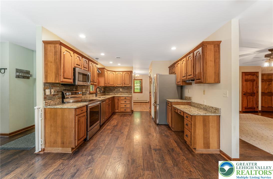 465 Raubsville Road Easton, PA 18042 - Photo 21 of 60 A galley kitchen with natural light offers ample workspace.