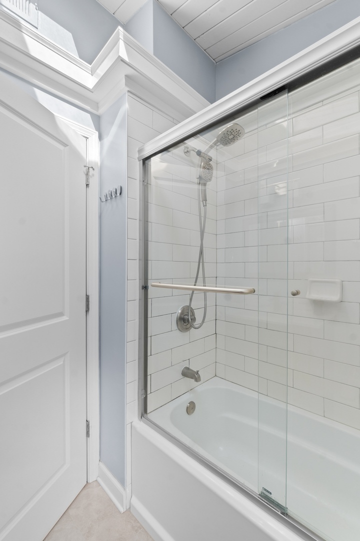 8 Rob Road Mount Prospect, IL 60056 - Photo 22 of 40 a bathroom with a shower and a bath tub