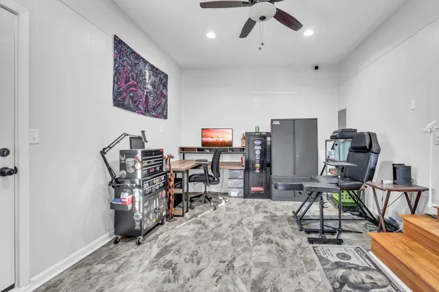 a view of a workspace with furniture