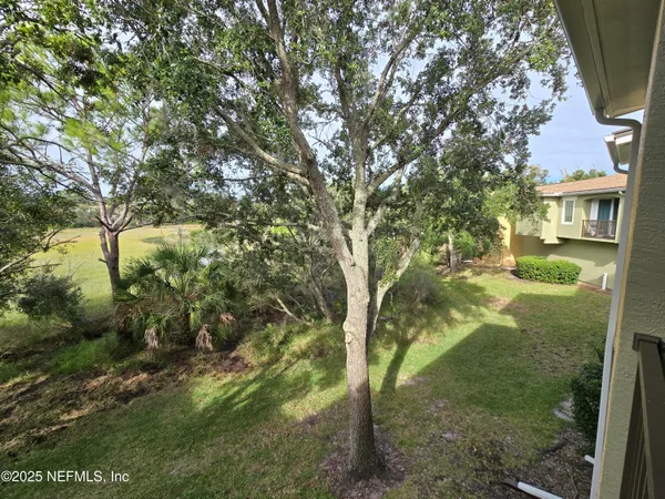 a view of a yard in front of a house