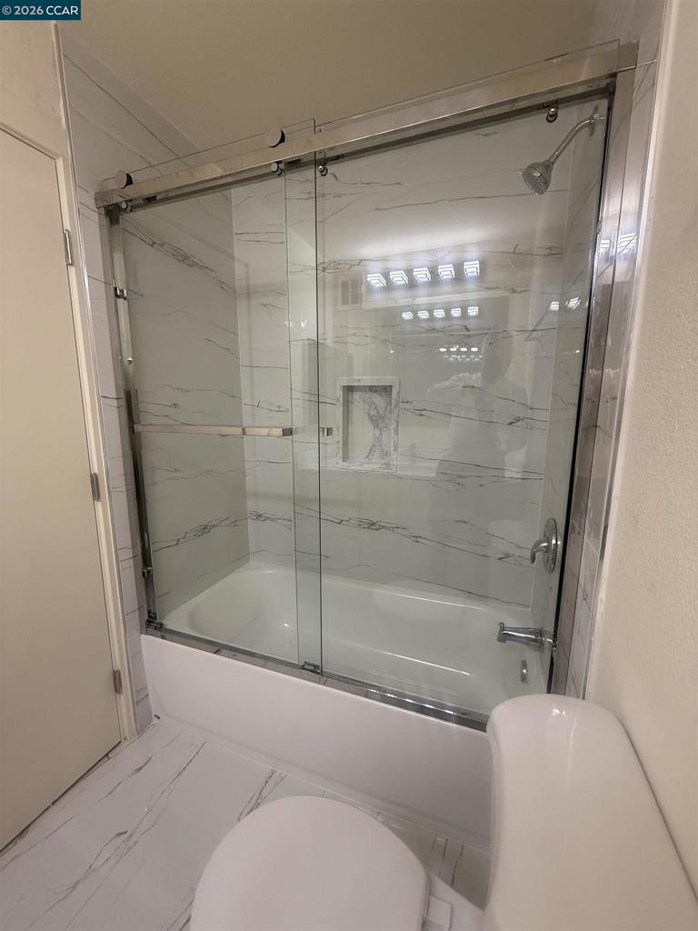 1591 Ellis Street Concord, CA 94520 - Photo 11 of 11 a bathroom with a shower and a glass door