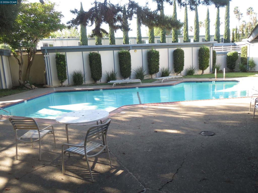 1591 Ellis Street Concord, CA 94520 - Photo 7 of 11 a view of swimming pool with seating area and yard