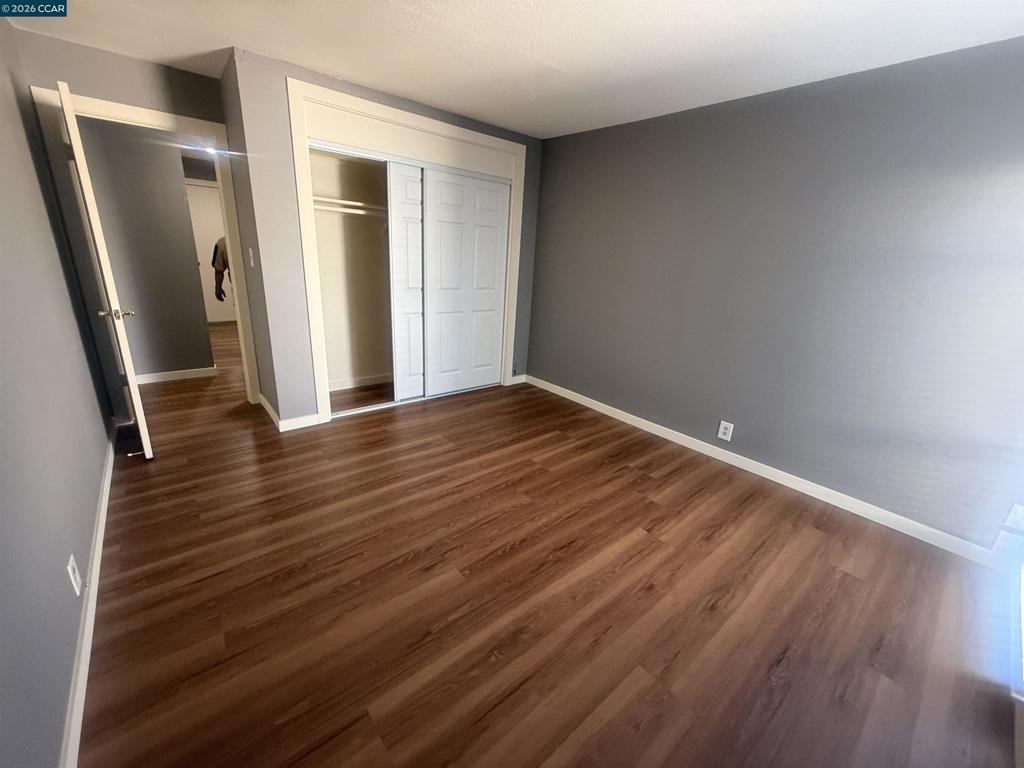 1591 Ellis Street Concord, CA 94520 - Photo 9 of 11 wooden floor in an empty room