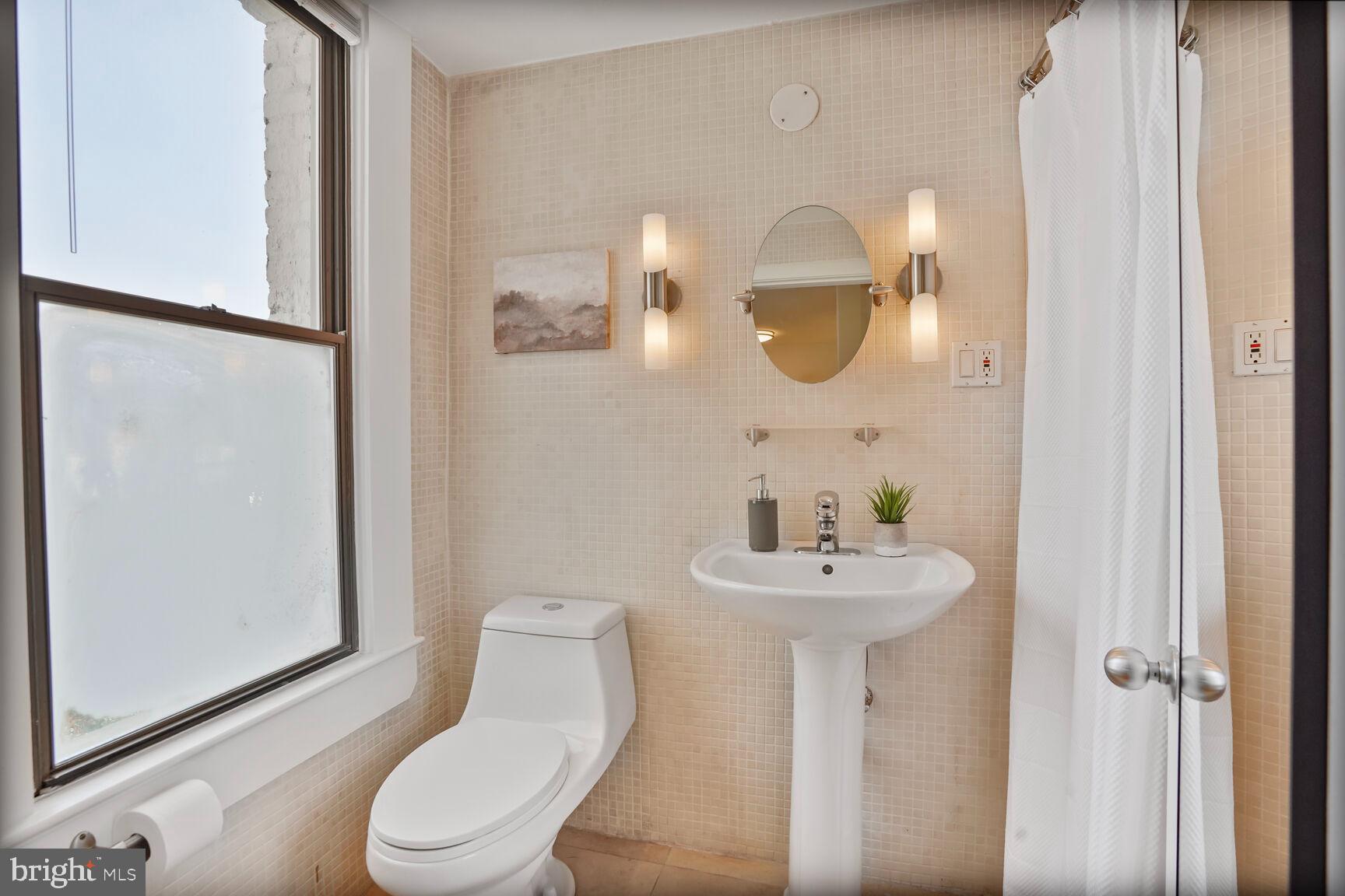 1822 15th Street Northwest, Unit 305 Washington, DC 20009 - Photo 11 of 23 Bathroom with tiled walls and big window