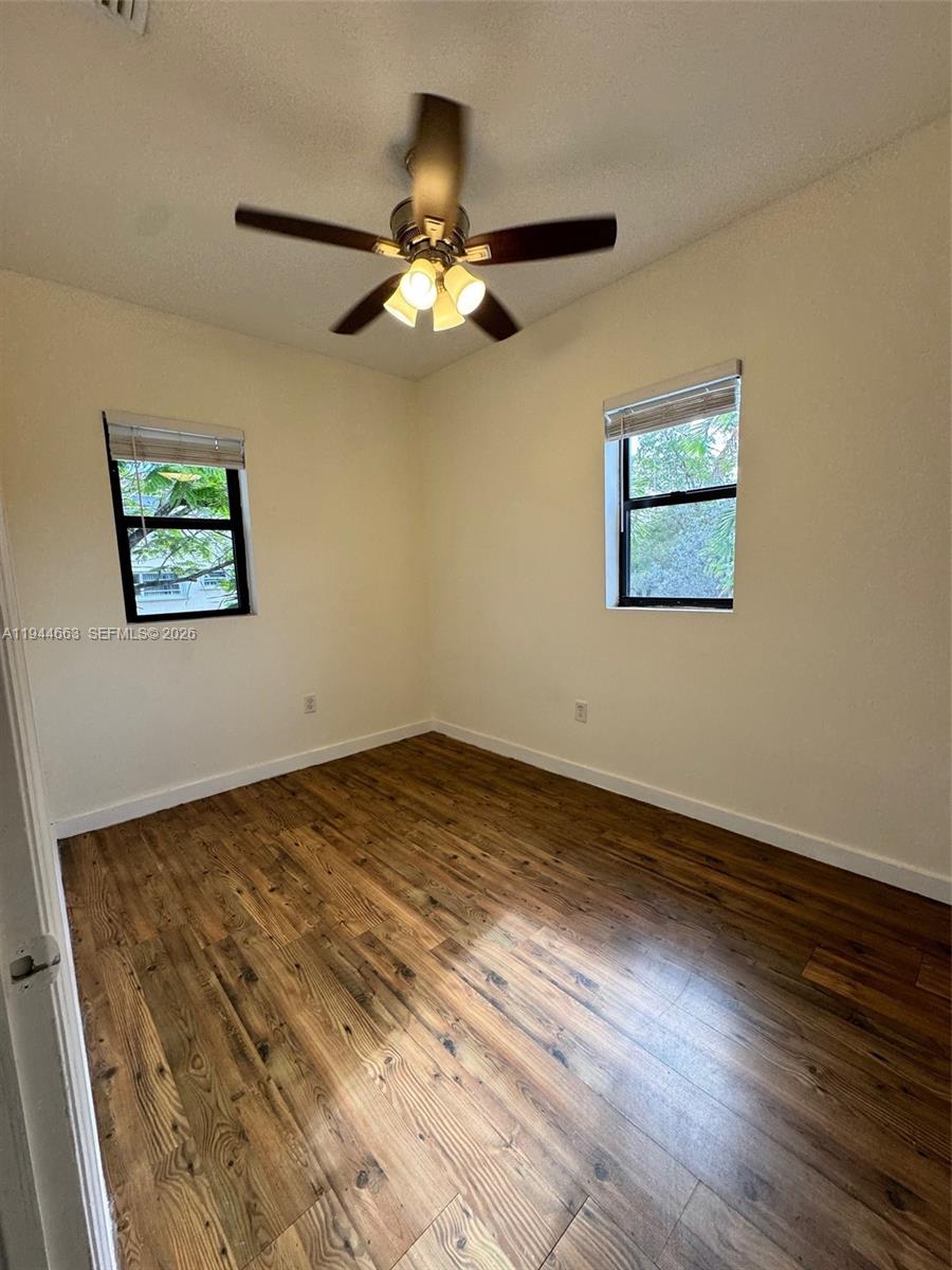 2000 Monroe Street, Unit 11 Hollywood, FL 33020 - Photo 11 of 22 a view of empty room with wooden floor