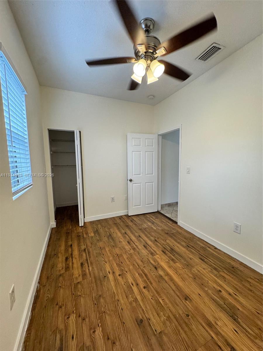 2000 Monroe Street, Unit 11 Hollywood, FL 33020 - Photo 12 of 22 a view of an empty room with a chandelier fan