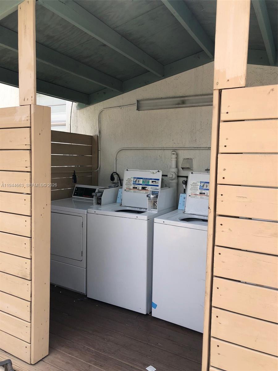 2000 Monroe Street, Unit 11 Hollywood, FL 33020 - Photo 21 of 22 a utility room with dryer and washer