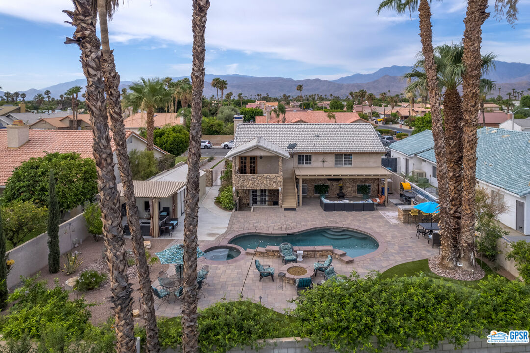 68554 Durango Road Cathedral City, CA 92234 - Photo 1 of 47 an aerial view of multiple houses with a yard
