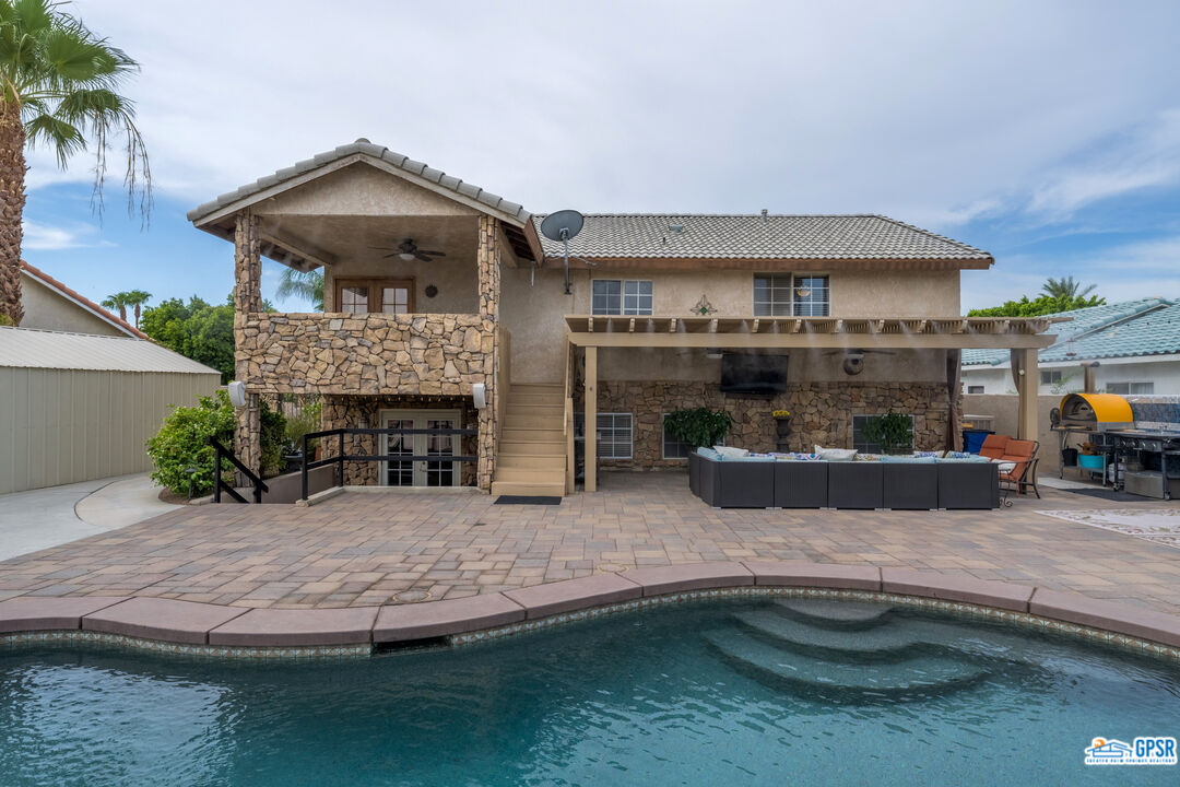 68554 Durango Road Cathedral City, CA 92234 - Photo 12 of 47 a view of house with outdoor space and swimming pool