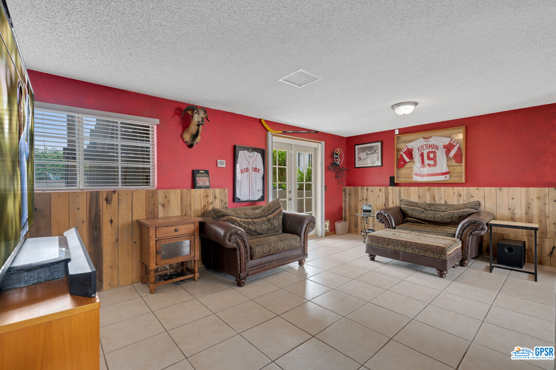68554 Durango Road Cathedral City, CA 92234 - Photo 14 of 47 a bedroom with furniture and a large window