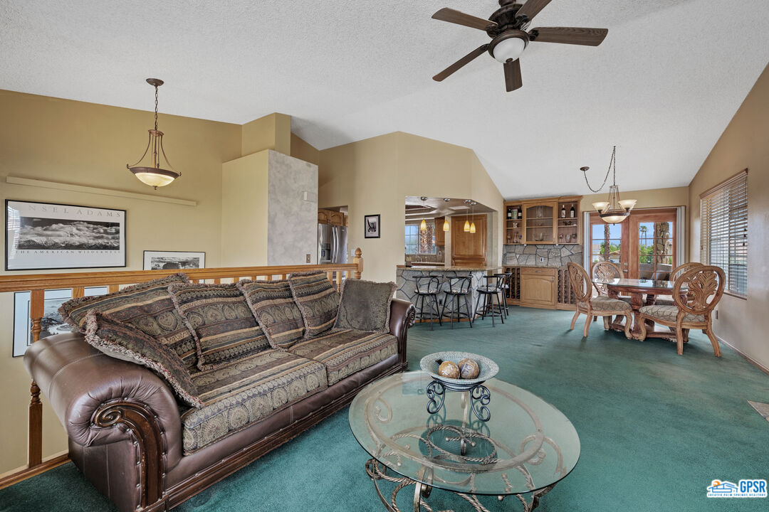 68554 Durango Road Cathedral City, CA 92234 - Photo 17 of 47 a living room with furniture and a chandelier