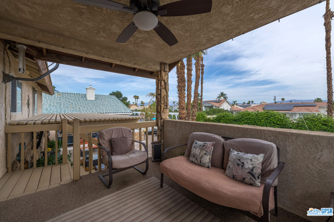 68554 Durango Road Cathedral City, CA 92234 - Photo 19 of 47 a roof deck with couch and chairs
