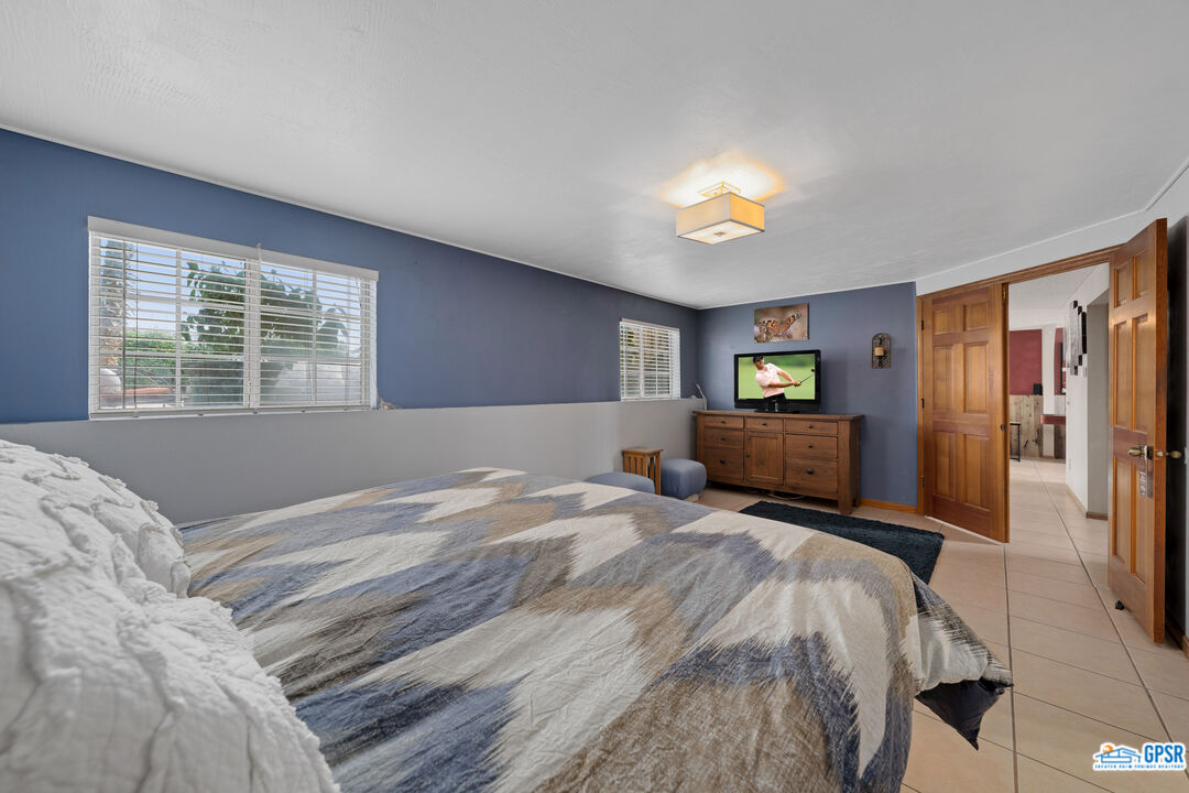 68554 Durango Road Cathedral City, CA 92234 - Photo 25 of 47 a bed room with a bed and a window