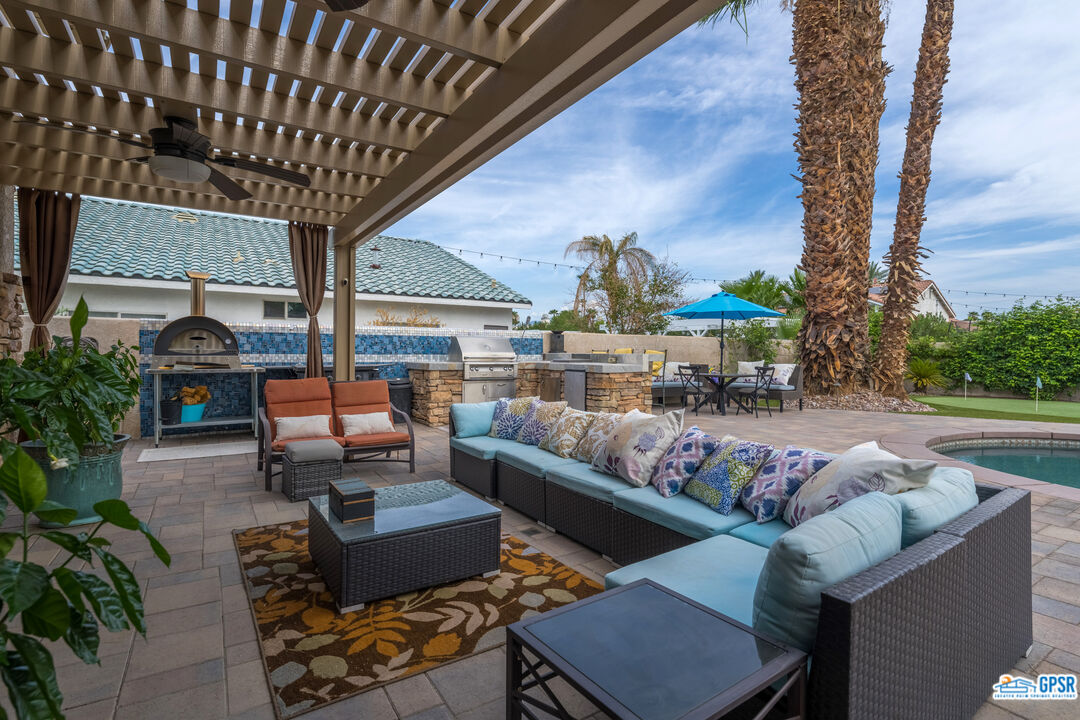 68554 Durango Road Cathedral City, CA 92234 - Photo 37 of 47 a outdoor living space with furniture and a potted plant