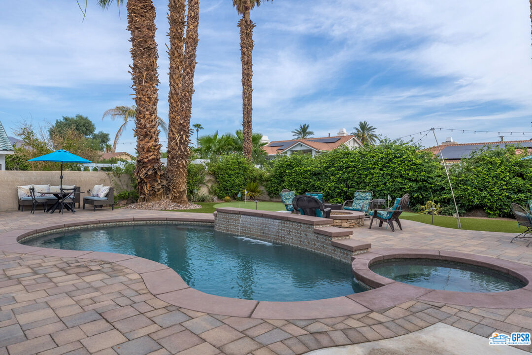 68554 Durango Road Cathedral City, CA 92234 - Photo 40 of 47 a view of a swimming pool with a patio