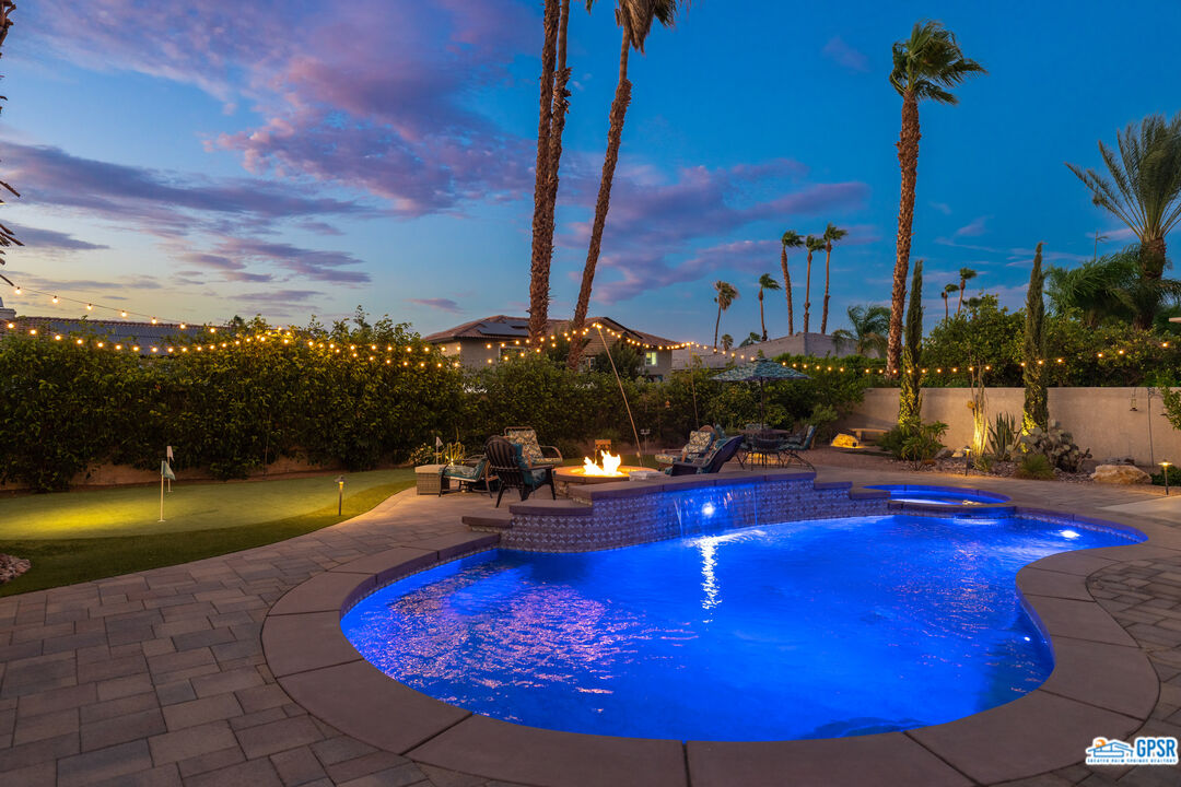 68554 Durango Road Cathedral City, CA 92234 - Photo 46 of 47 a view of a swimming pool with a table and chairs