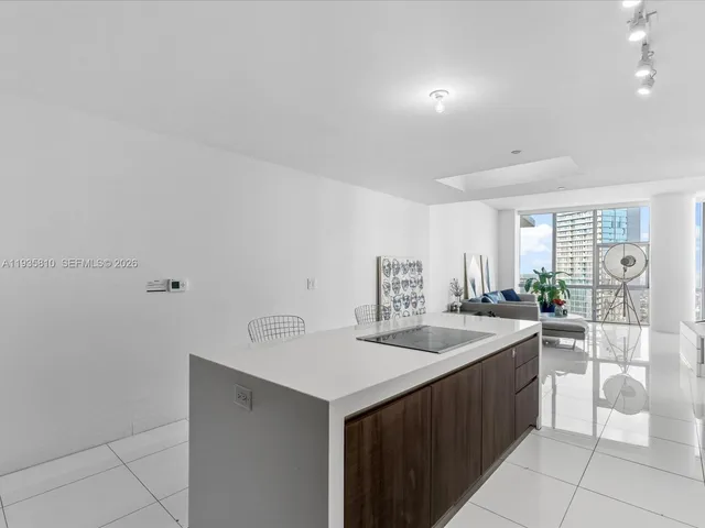 a view of a living room and chandelier