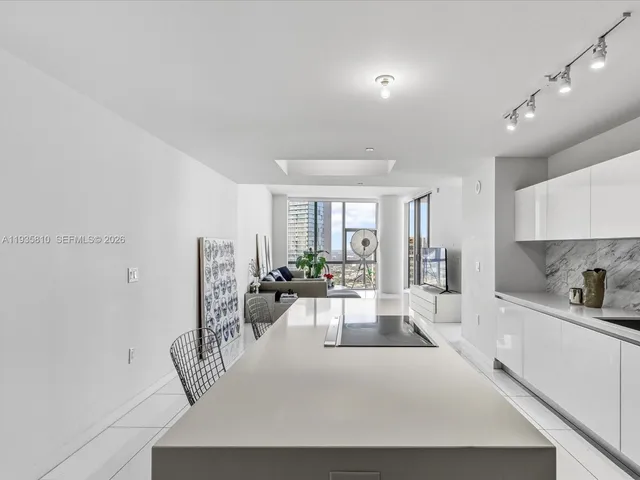 a view of entryway with kitchen