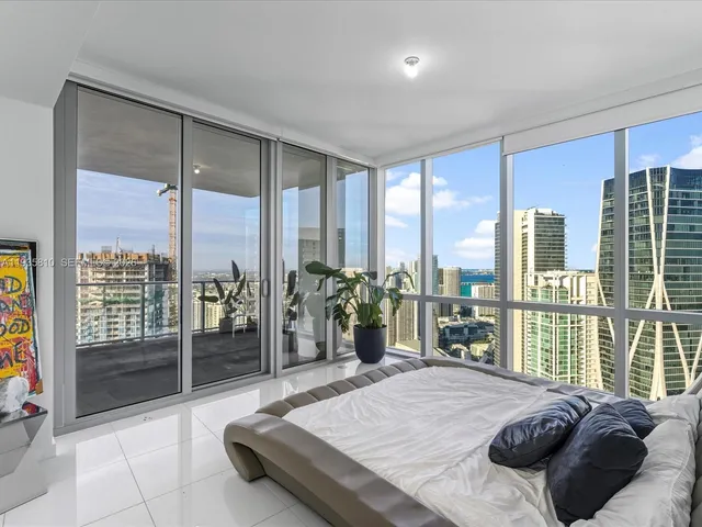 a living room with furniture and a night stand