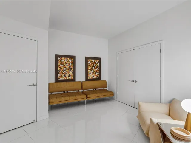 a living room with furniture and lamp