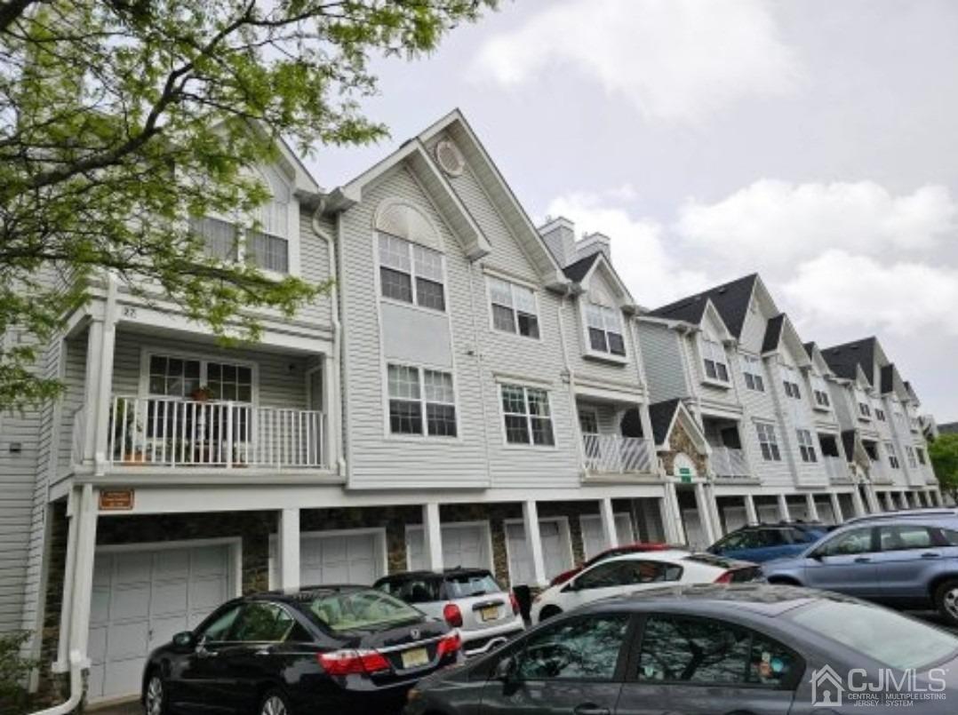 112 Prestwick Way Edison, NJ 08820 - Photo 16 of 24 a front view of a building with cars parked